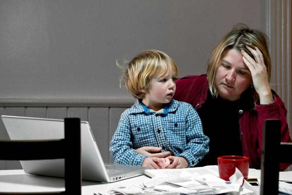 mom confused with toddler sitting on her lap