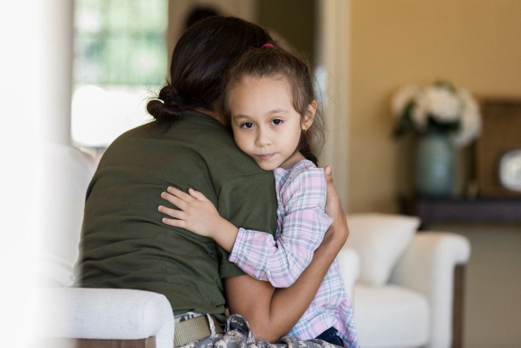 little girl hugging her mom