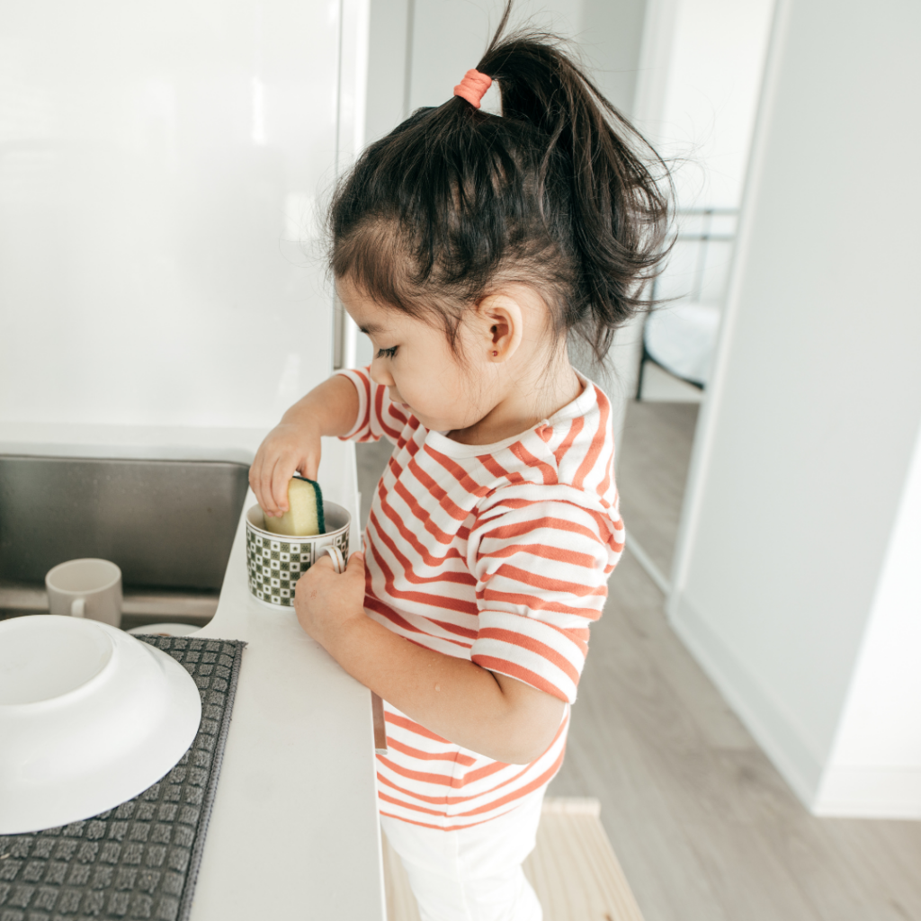 Girl washing dishes